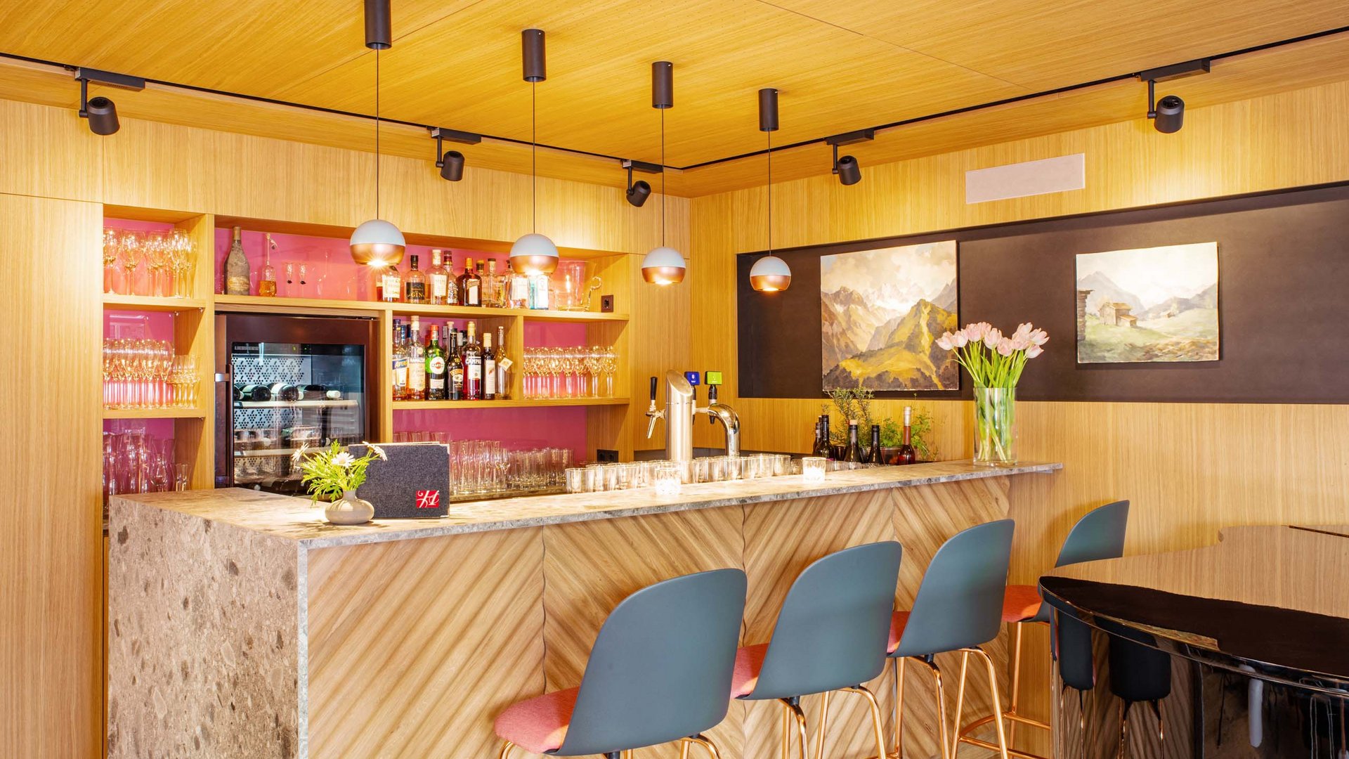 Your hotel in Oberstdorf with half board Modern bar area with wooden panels and blue bar stools
